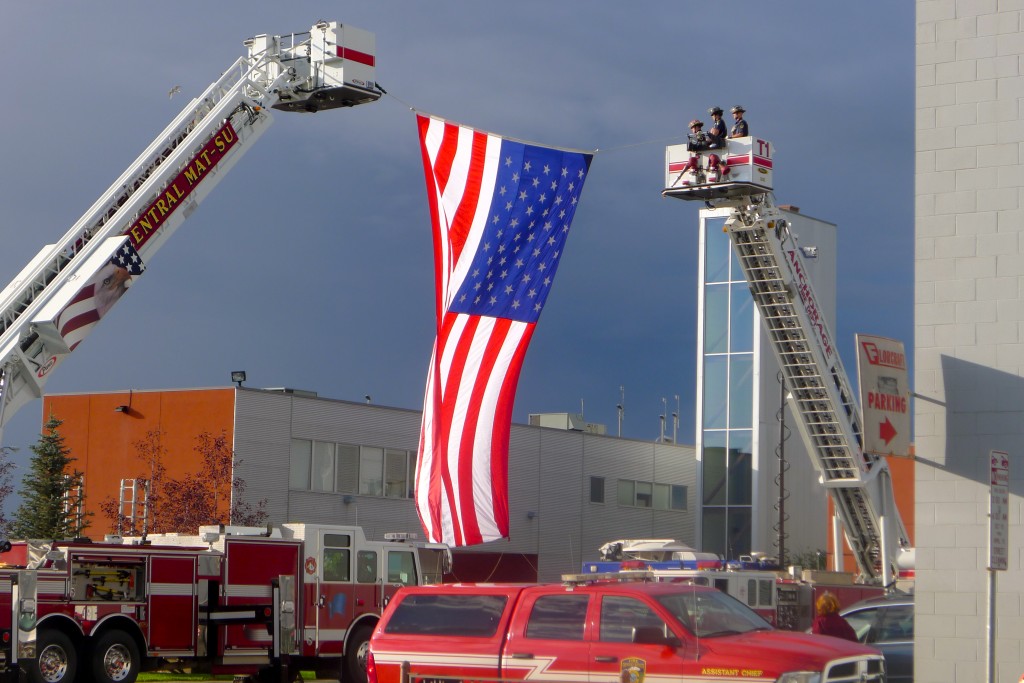 Firefighters and flag